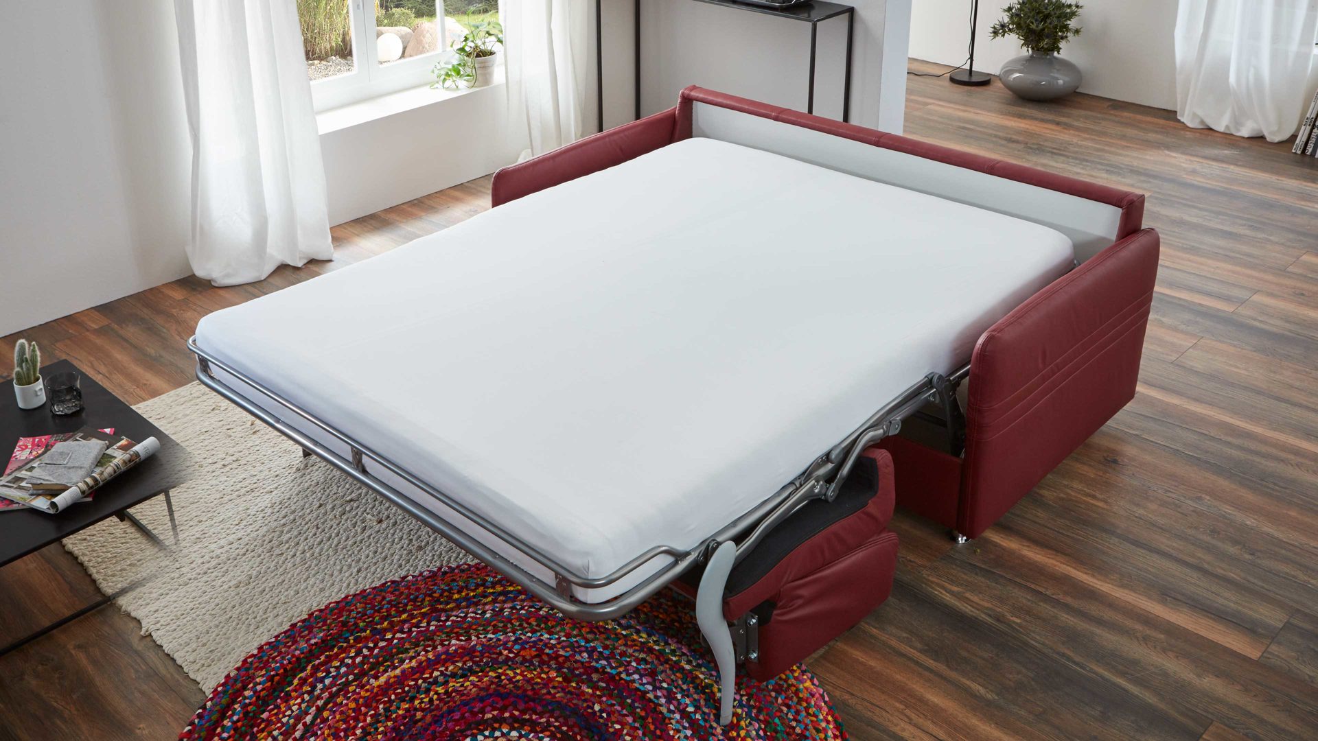 Schlafsofa comfortmaster besser sitzen, liegen, leben aus Leder in Rot Comfortmaster Messina Funktionssofa - Schlafcouch dunkelrotes Leder 20-1030 & Chromfüße 84 - Breite ca. 157 cm