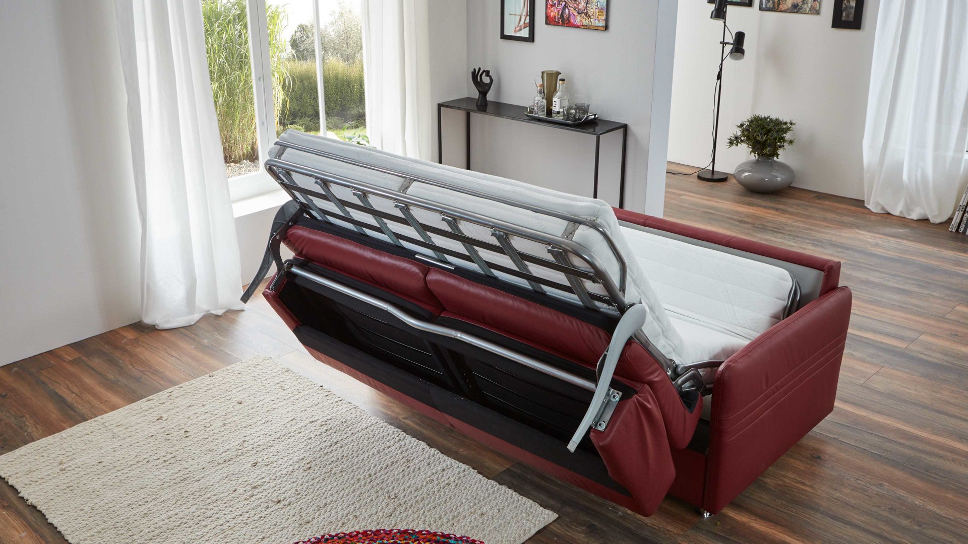 Schlafsofa comfortmaster besser sitzen, liegen, leben aus Leder in Rot Comfortmaster Messina Funktionssofa - Schlafcouch dunkelrotes Leder 20-1030 & Chromfüße 84 - Breite ca. 157 cm