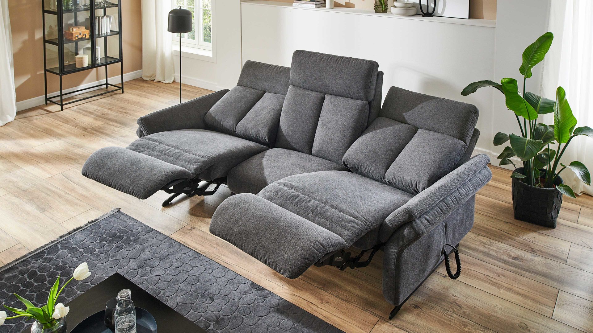 Dreisitzer OrthoSedis aus Stoff in Anthrazit Polsterprogramm OrthoSedis 4.0 - Rundsofa mit Funktionen anthrazitfarbener Stoffbezug Sofia clean - Länge ca. 235 cm