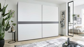 Kleiderschrank Interliving aus Holz in Weiß Interliving Kleiderschrank Serie 1207 – Schwebetürenschrank Weiß & Manhattan – zwei Türen, Breite ca. 301 cm