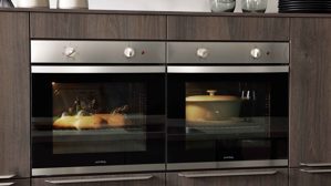 Einbauküche WERT KÜCHE® aus Holz in Grau WERT KÜCHE® Mattea mit Einbaugeräten und großer Kücheninsel Kieselgrau & Nebraska Eiche - zweiteilig