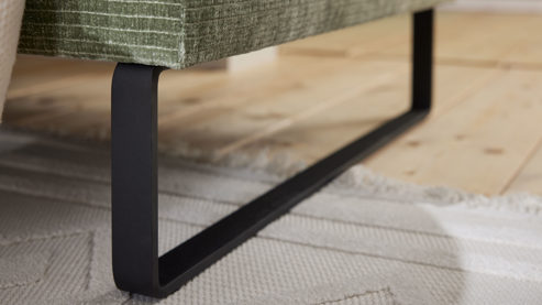 Ecksofa Roomio® aus Stoff in Grün Roomio® No. 4105 - Ecksofa schildkrötenfarbener Bezug Monty & schwarze Kufenfüße 256 MK - Stellfläche ca. 278 x 221 cm